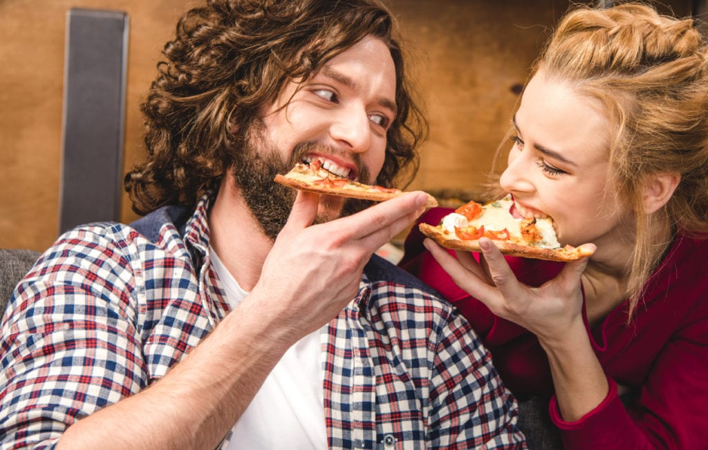 live a little - couple eating pizza