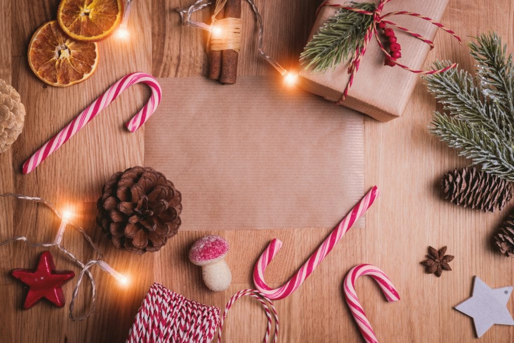 Festive objects laid out on a wooden background